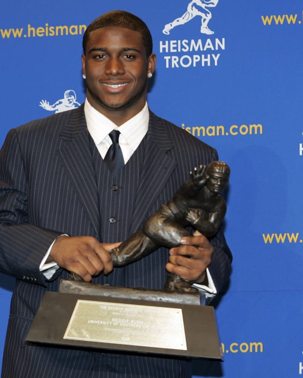 Reggie Bush, University of Southern California tailback holds  the Heisman Trophy during the 2005 Heisman Trophy presentation at the Hard Rock Cafe in New York City, New York on December 10, 2005. Bush received 2,541 points in the ballot. (Photo by Michael Cohen/WireImage)