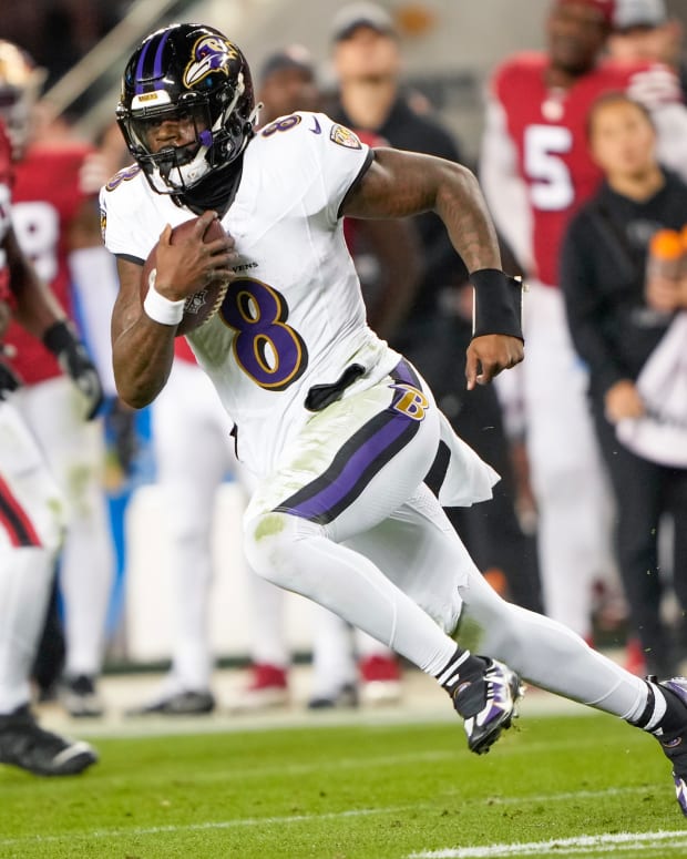 SANTA CLARA, CALIFORNIA - DECEMBER 25: Lamar Jackson #8 of the Baltimore Ravens runs the ball during the second quarter against the San Francisco 49ers at Levi's Stadium on December 25, 2023 in Santa Clara, California. (Photo by Thearon W. Henderson/Getty Images)