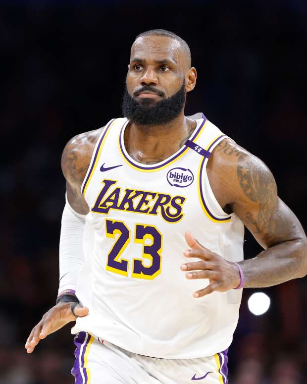 Los Angeles Lakers forward LeBron James (23) reacts after scoring against the Oklahoma City Thunder during the second half at Paycom Center.