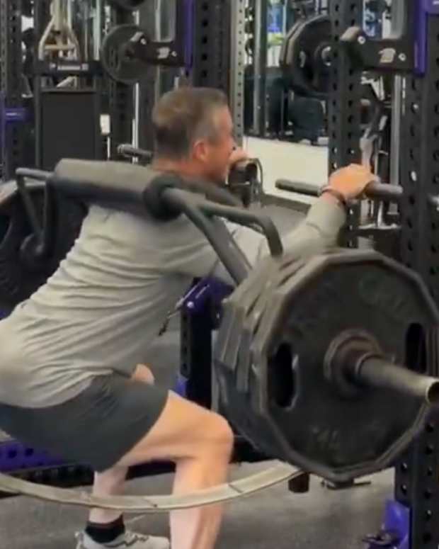 Ravens head coach John Harbaugh squatting 405 pounds.