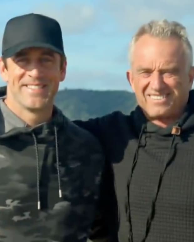 Aaron Rodgers and Robert F. Kennedy Jr. hiking.