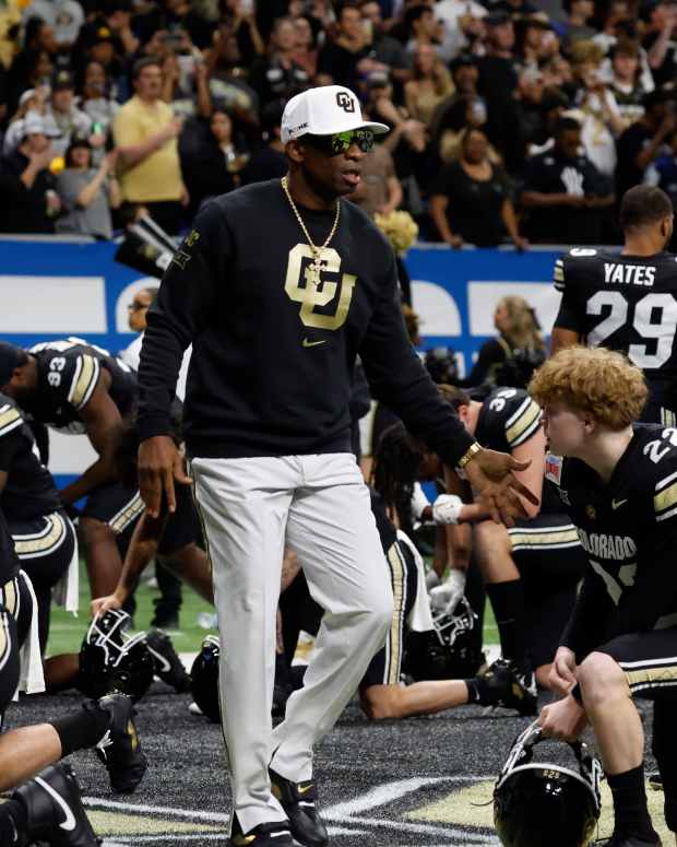 Deion Sanders on field.