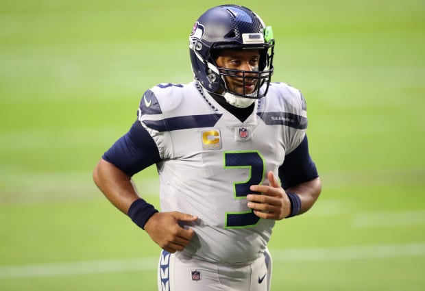 Seattle Seahawks quarterback Russell Wilson holds the Vince