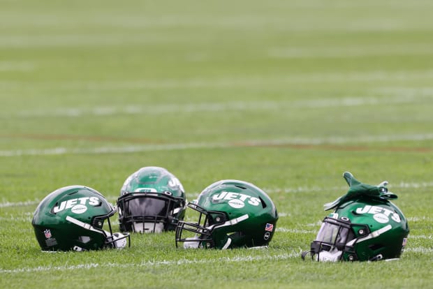 Wrestlers grapple with football at Jets camp