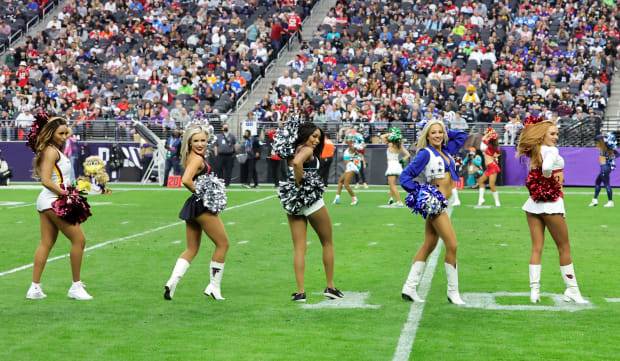 NFL star Stefon Diggs crouches behind cheerleaders' bums as part of  'absurd' routine - Daily Star