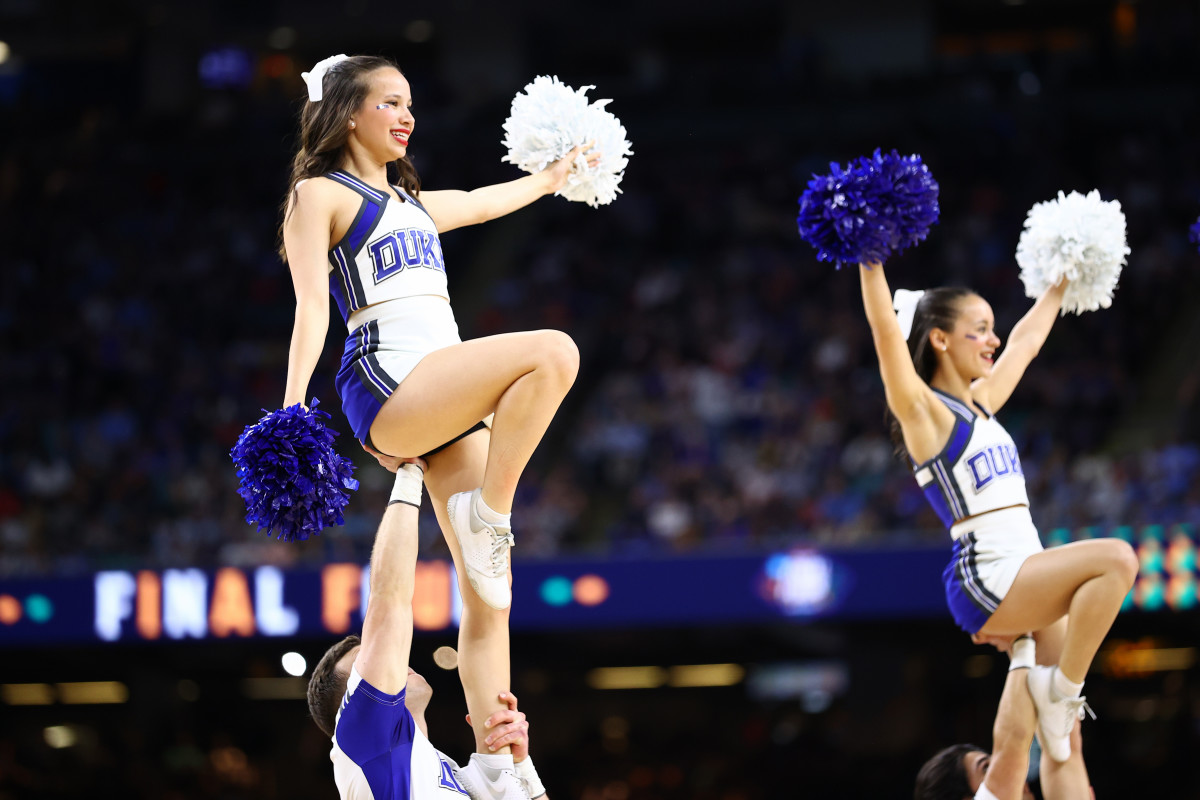 A Washington Commanders cheerleader performs during the second