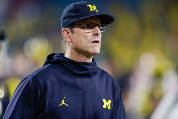 Jim Harbaugh's new thing: Wearing jerseys of local legends around