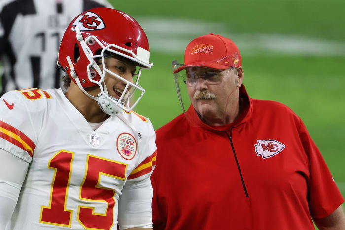 Kansas City Chiefs quarterback Patrick Mahomes talks with head coach Andy Reid.