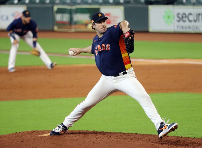 Astros pitcher Justin Verlander delivers a pitch during a team workout.