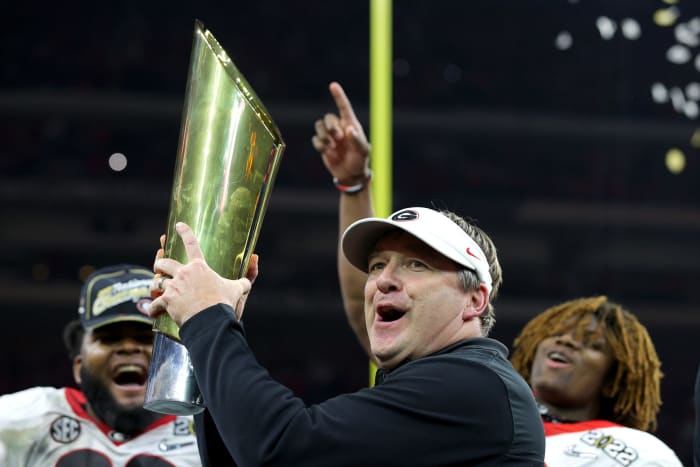 Kirby Smart with the championship trophy.