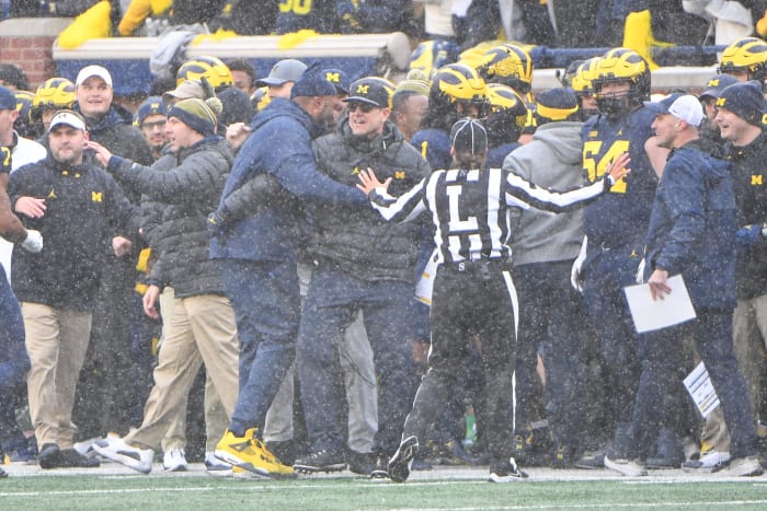 Michigan head coach Jim Harbaugh celebrates his win over Ohio State.