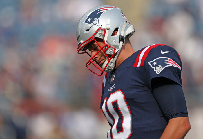 Patriots quarterback Mac Jones on the field.