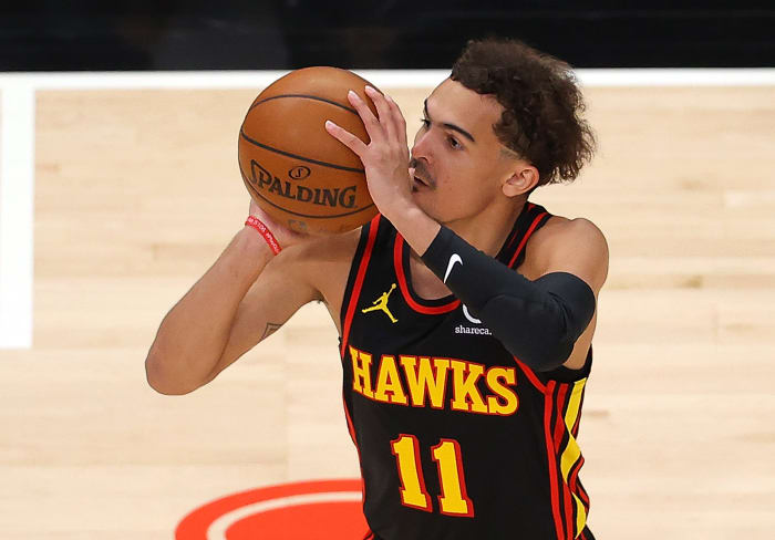 Trae Young shoots the ball from beyond the three-point line.