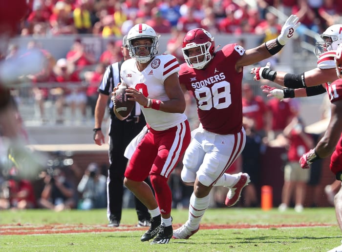 Nebraska's Adrian Martinez tries to outrun an Oklahoma defender.