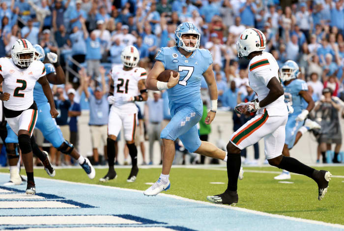 North Carolina Tar Heels quarterback Sam Howell runs in a touchdown against Miami.