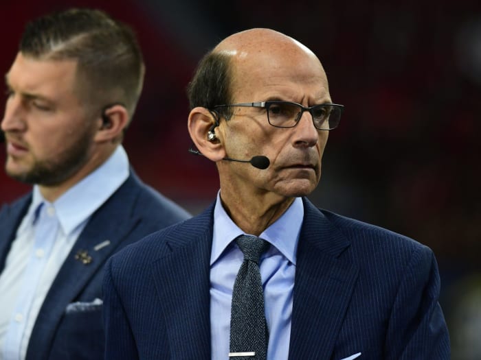 Paul Finebaum looks on.