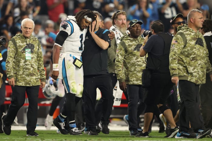 Cam Newton with Matt Rhule on the sidelines.