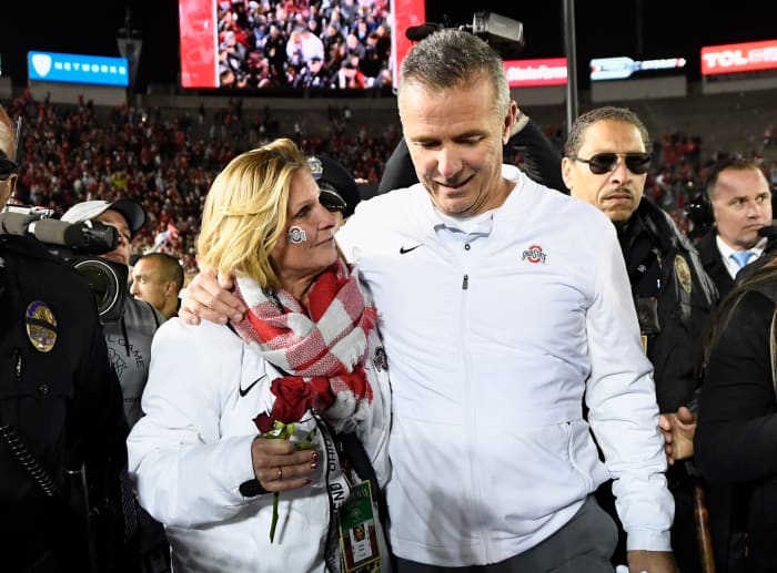 urban meyer and his wife shelley meyer after the rose bowl