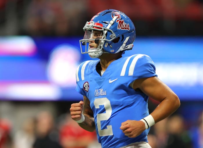 Ole Miss quarterback Matt Corral jogs off the field.