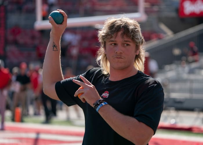 Quinn Ewers throws a ball.