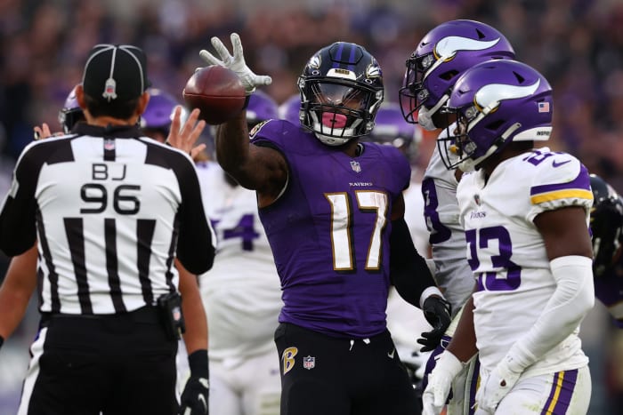 Baltimore Ravens running back Le'Veon Bell celebrates after a play.