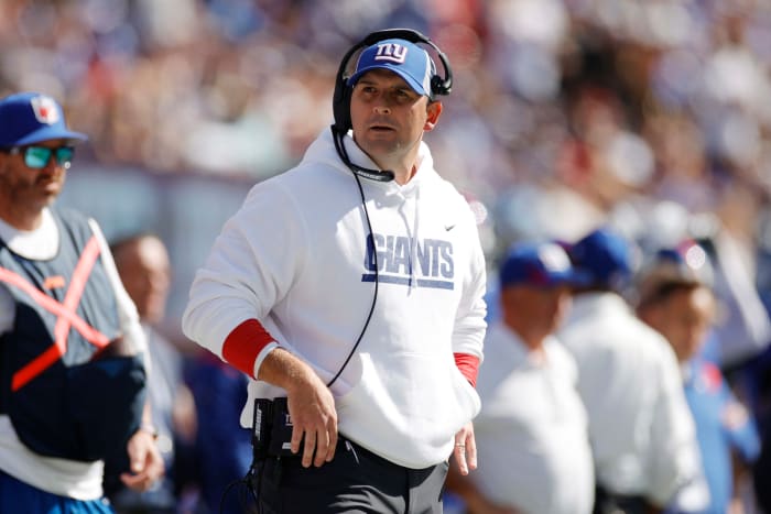 Giants head coach Joe Judge stands on the sideline.