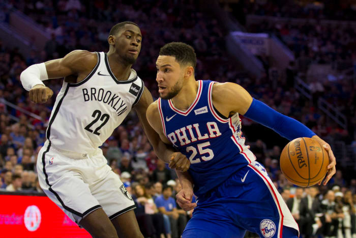 76ers point guard Ben Simmons drives past Caris LeVert on his way to the basket.