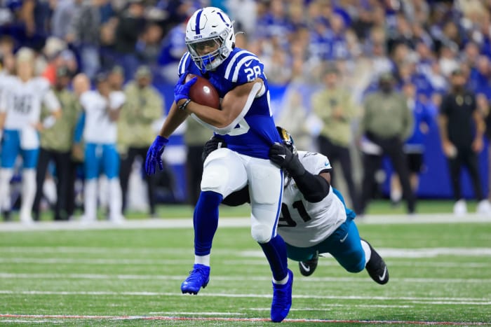 Colts running back Jonathan Taylor sheds a Jaguars' tackler.