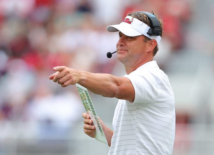 Ole Miss head coach Lane Kiffin points.