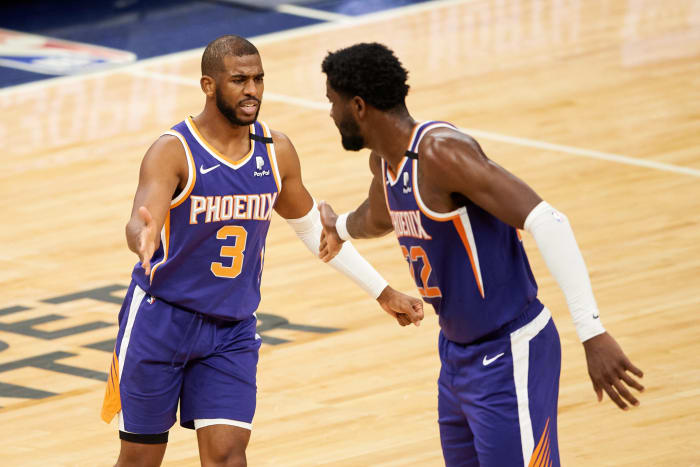 Chris Paul high fives Deandre Ayton after a foul during a Suns regular season game.