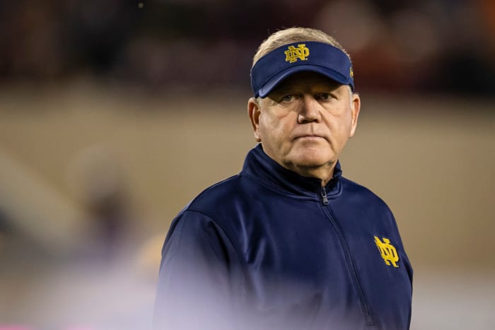 Notre Dame head coach Brian Kelly looks on.