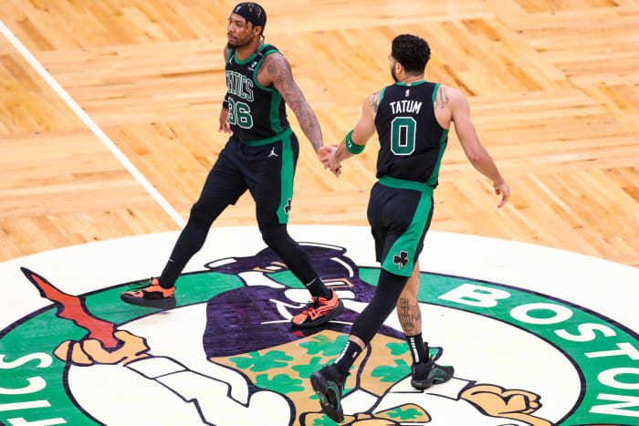 Marcus Smart and Jayson Tatum at midcourt.