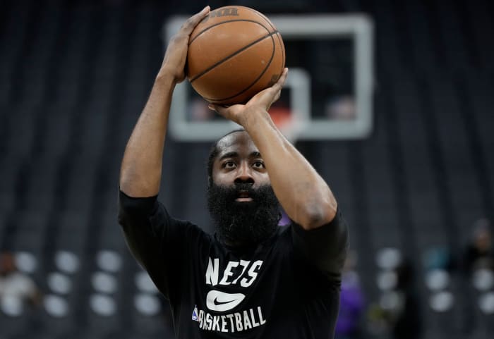 Nets star James Harden warms up.