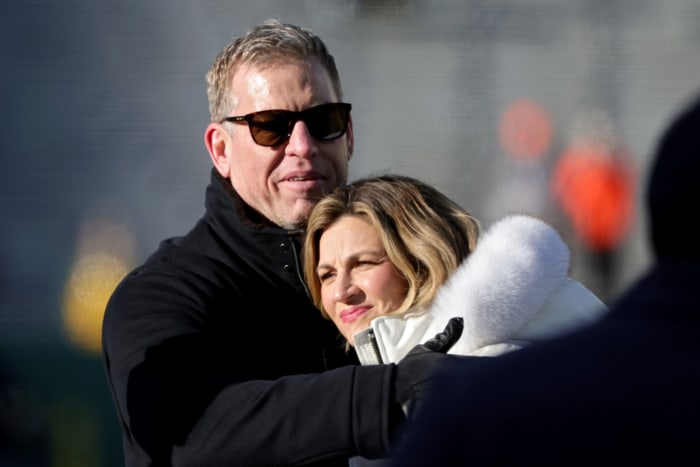 Troy Aikman on the field with Erin Andrews.