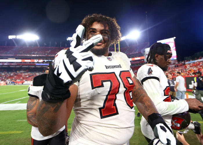 Bucs offensive lineman Tristan Wirfs throws up two fingers for the camera.