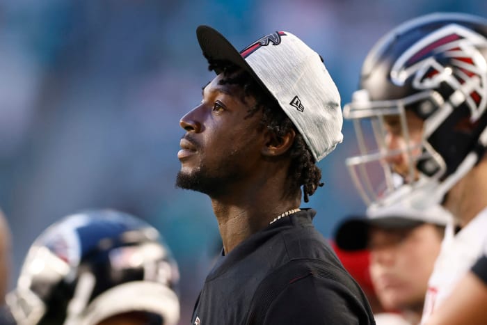 Falcons wide receiver Calvin Ridley looks on from the sidelines.