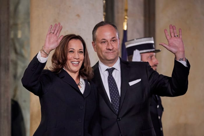 Kamala Harris and Douglas Emhoff waving.