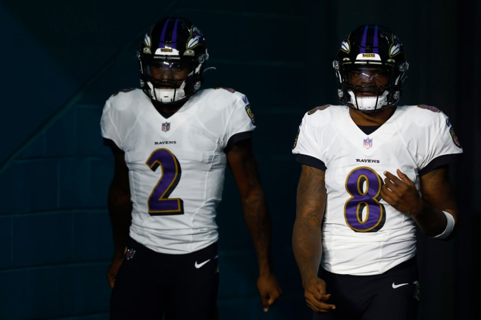 Ravens quarterbacks Tyler Huntley and Lamar Jackson walk out of the tunnel prior to a game.