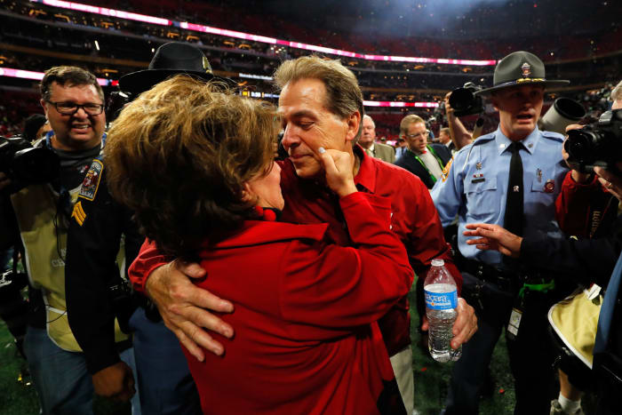 Head coach Nick Saban of the Alabama Crimson Tide celebrates with his wife Terry after beating the Georgia Bulldogs.