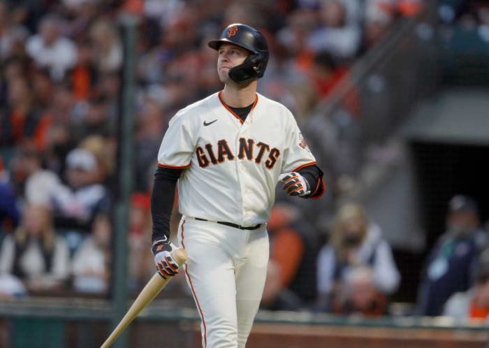 Buster Posey walks off the field.