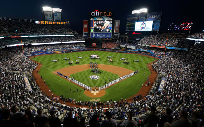 Mets and Yankees line up before a game.