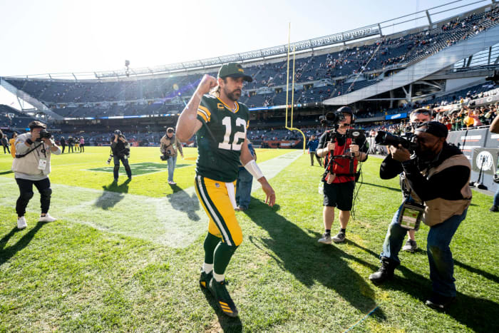 Aaron Rodgers runs off the field in Chicago after beating the Bears.