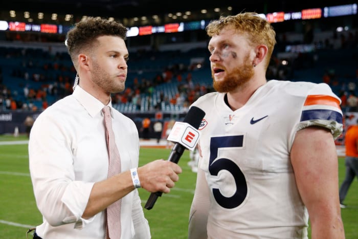 ESPN reporter Harry Lyles Jr. interviews Virginia's Brennan Armstrong.