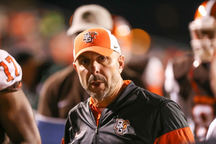 Carl Pelini walks of the field.