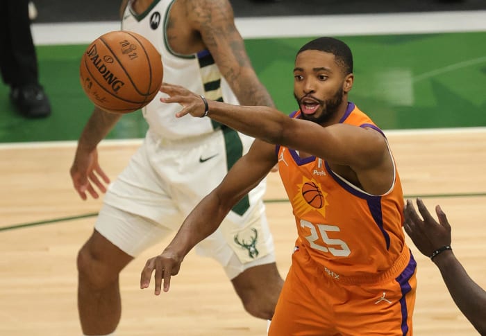 Suns wing Mikal Bridges passes the ball.
