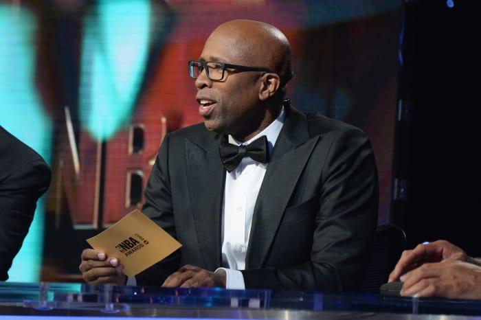TNT analyst and former NBA basketball player Kenny "The Jet" Smith speaks on stage.