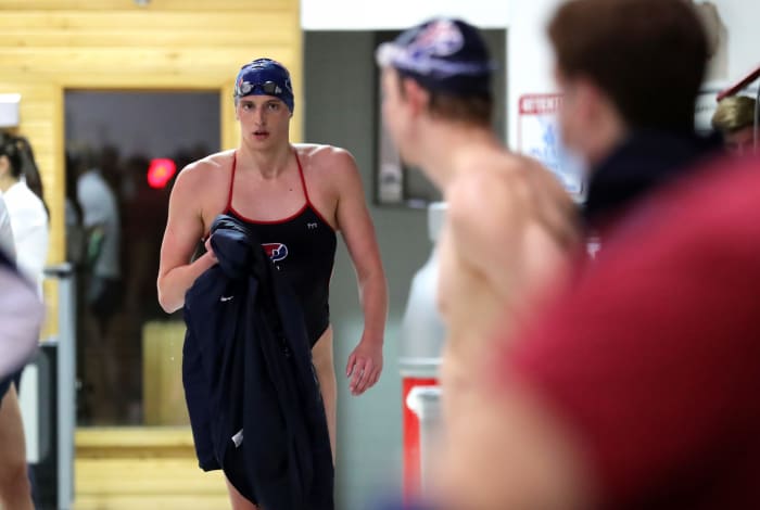 Lia Thomas walks out of the pool.