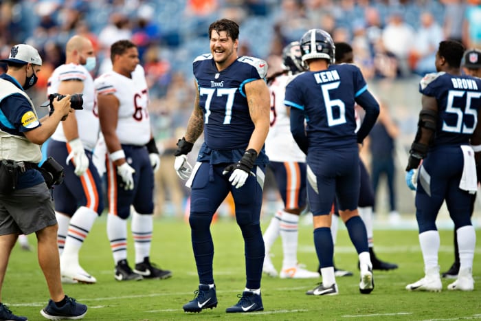 Tennessee Titans tackle Taylor Lewan on the field ahead of a game.