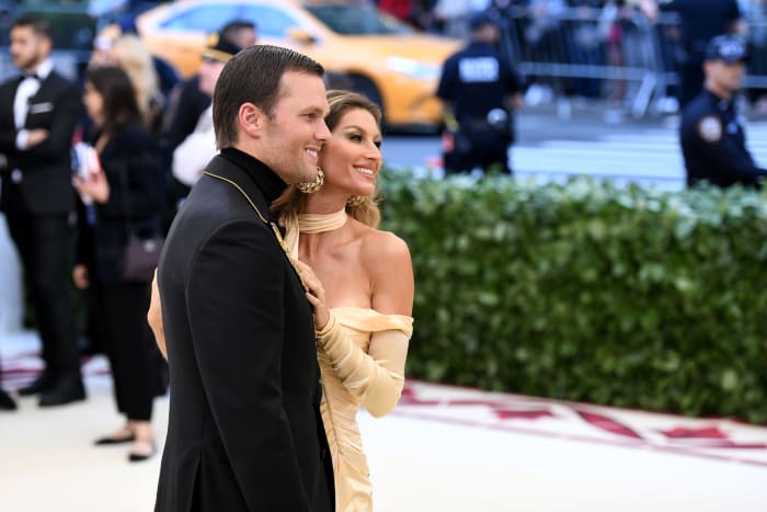 Tom Brady and Gisele dressed up at an event.