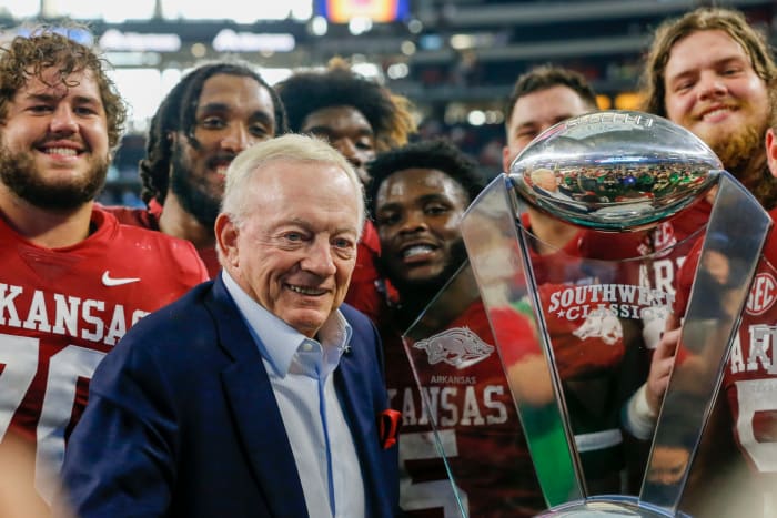 Jerry Jones celebrates with Arkansas football after a win at AT&T Stadium over Texas A&M.